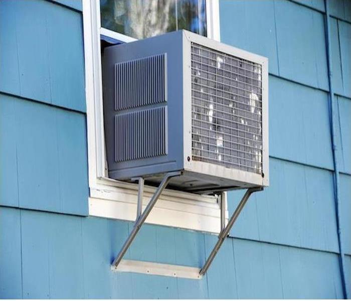 Outside of home with window air conditioner