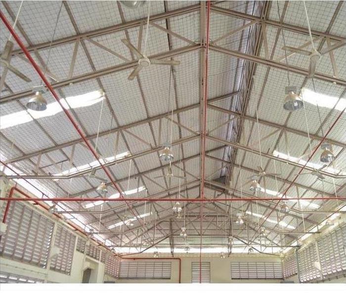Sprinkler systems installed on a high vaulted ceiling.
